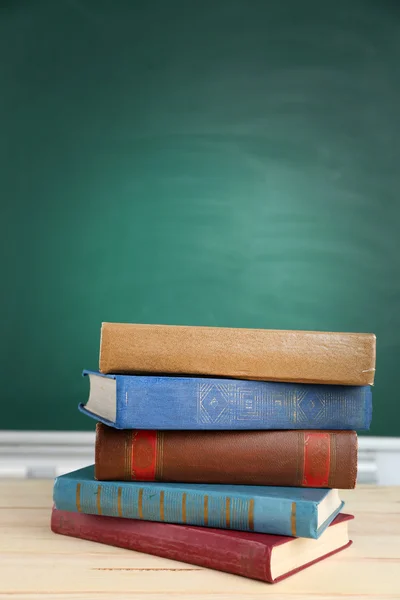 Stack of books on desk — Stock Photo, Image