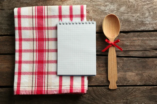 Open recipe book on wooden background — Stock Photo, Image