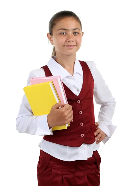 Beautiful little girl in school uniform isolated on white — Stock Photo, Image