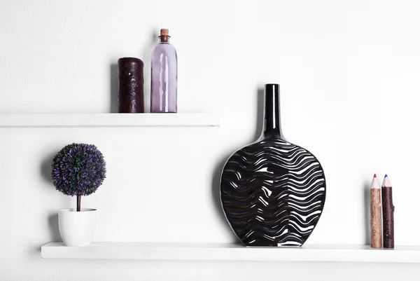 Decorative vases on wooden shelf — Stock Photo, Image