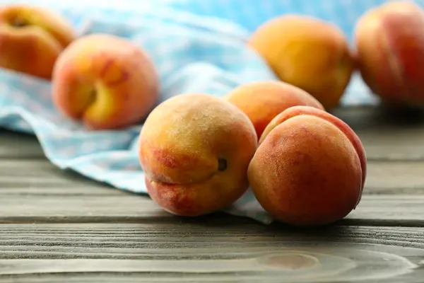 Sweet ripe peaches on table close up — Stock Photo, Image