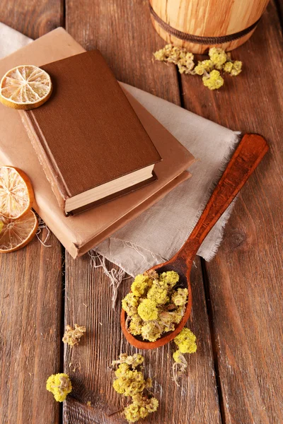 Books with dry flowers and lemon — Stock Photo, Image