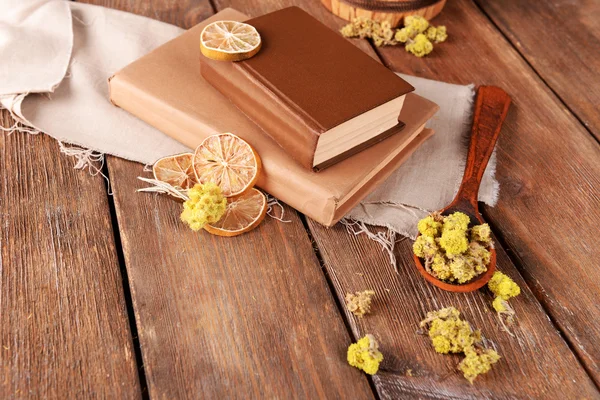 Books with dry flowers and lemon — Stock Photo, Image