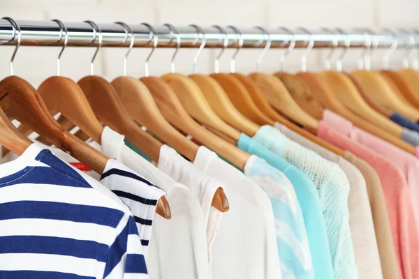 Different clothes on hangers — Stock Photo, Image