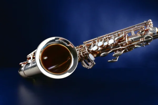 Golden saxophone on blue background — Stock Photo, Image