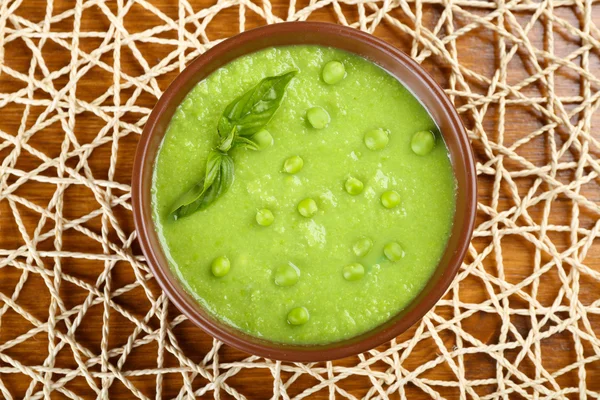 Tasty peas soup on table close up — Stock Photo, Image