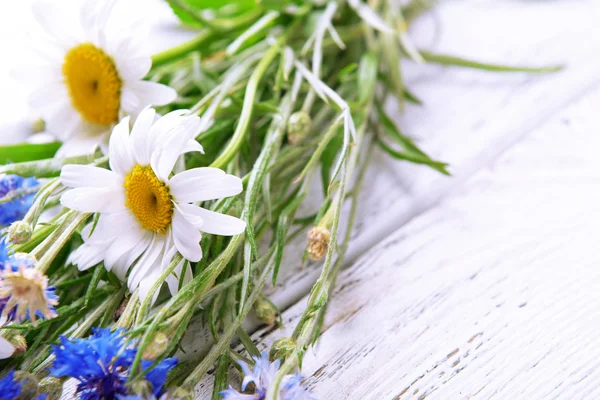 Fresh wildflowers on wooden table, closeup — Stock Photo, Image