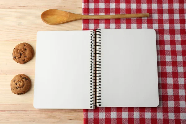 Open recipe book on wooden background — Stock Photo, Image