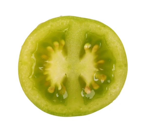 Половина зеленого помідора ізольовано на білому — стокове фото