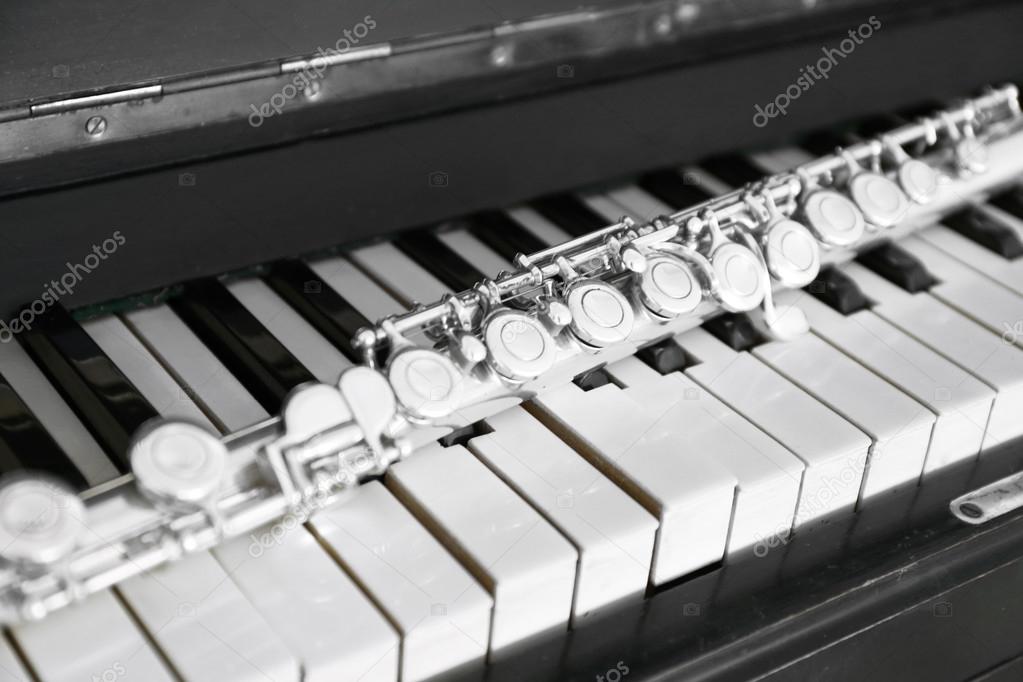 Flute on piano keys