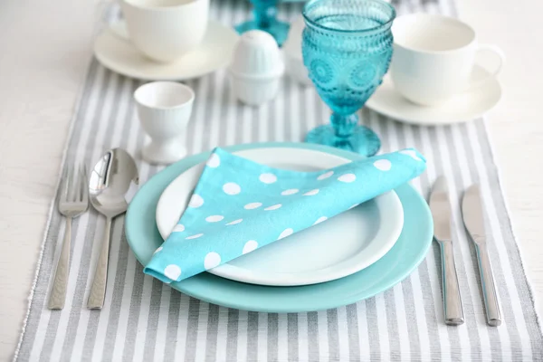 Beautiful holiday table setting in white and blue color — Stock Photo, Image