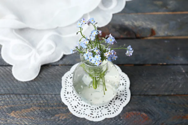 Composition with Forget-me-nots flowers on wooden background — Stock Photo, Image