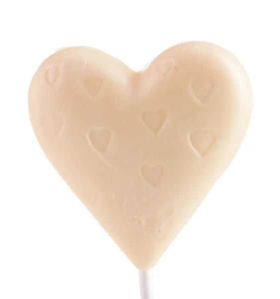 Chocolate caramelo en forma de corazón en palo aislado en blanco —  Fotos de Stock