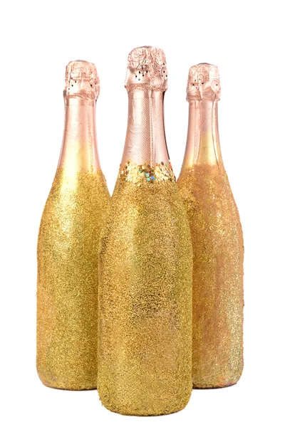 Ljusa flaskor champagne isolerad på vit — Stockfoto