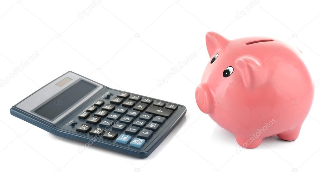 Piggy bank with calculator isolated on white