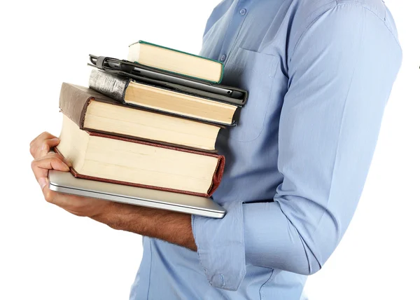 Hombre sosteniendo pila de libros con portátil y tableta aislada en blanco —  Fotos de Stock