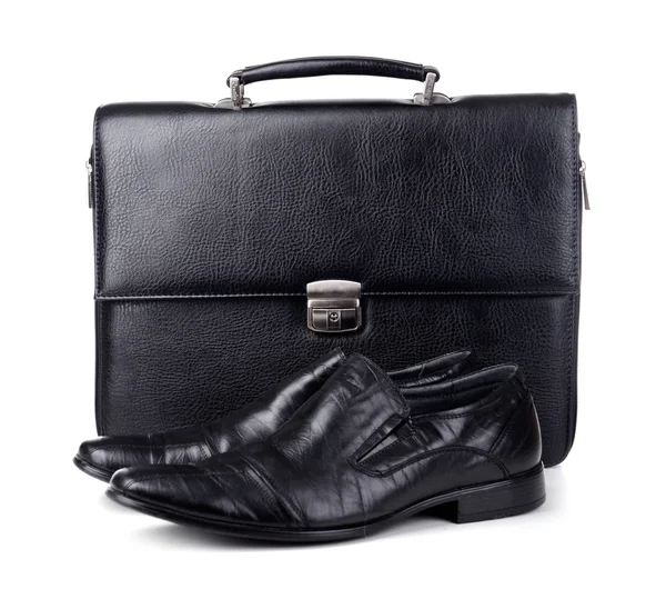 Black leather briefcase with shoes isolated on white — Stock Photo, Image