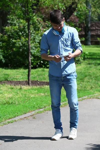 Man with headphones outdoors — Stock Photo, Image