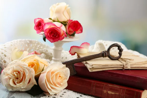 Fresh roses with old books — Stock Photo, Image