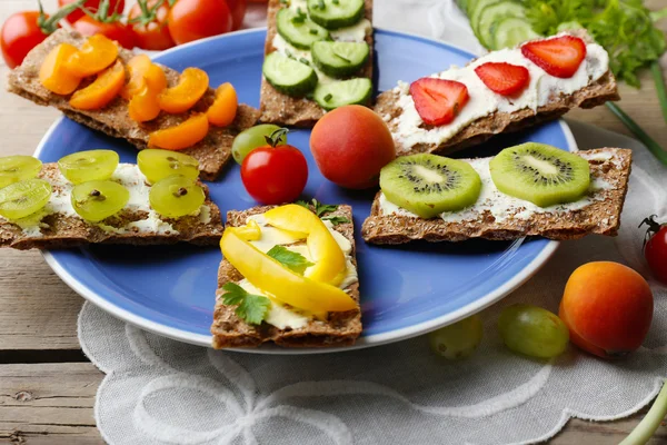 Still life with vegetarian sandwiches on wooden table — Stock Photo, Image