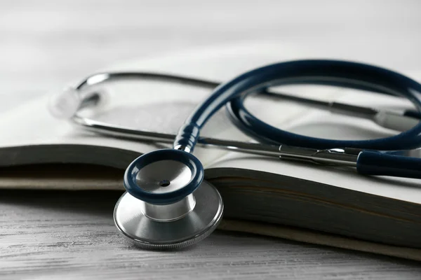 Stethoscope on open book close up — Stock Photo, Image