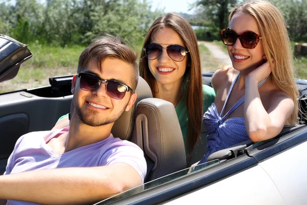 Three friends in cabriolet, outdoors — Stock Photo, Image