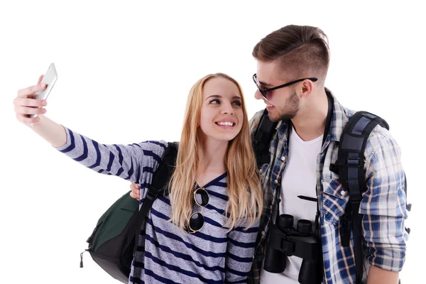 Pareja de viajeros haciendo fotos con cámara de teléfono aislada en blanco —  Fotos de Stock