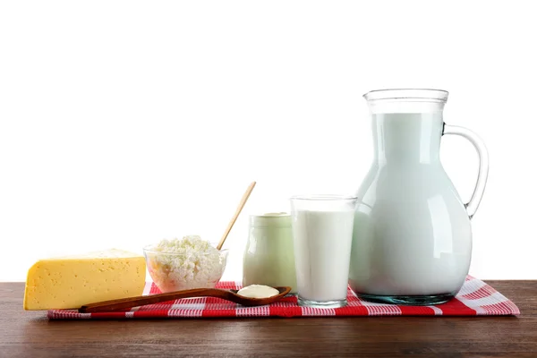 Mejeriprodukter på träbord på vit bakgrund — Stockfoto