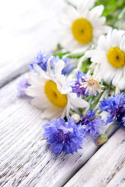 Fresh wildflowers on wooden table, closeup — Stock Photo, Image