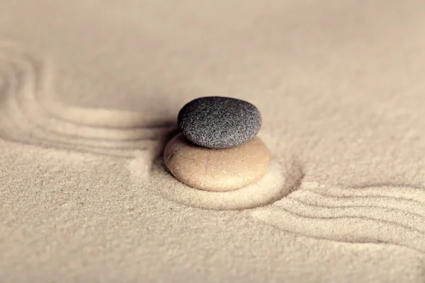 Zen garden with stones on sand background — Stock Photo, Image