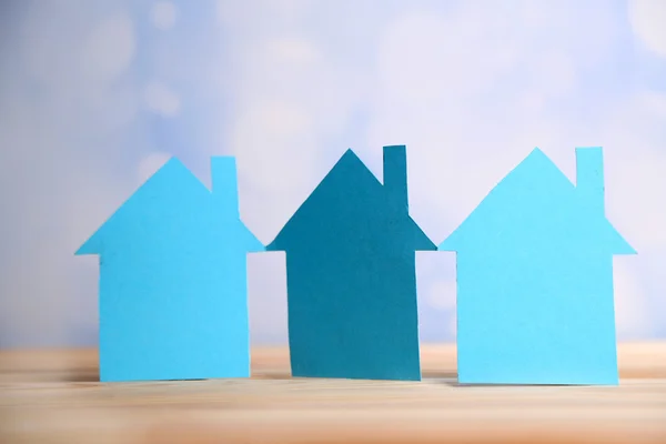 Paper houses on bright background — Stock Photo, Image