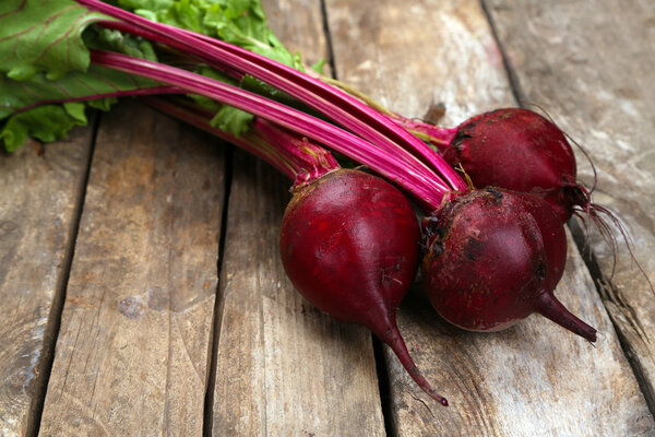 Young beets on wooden table