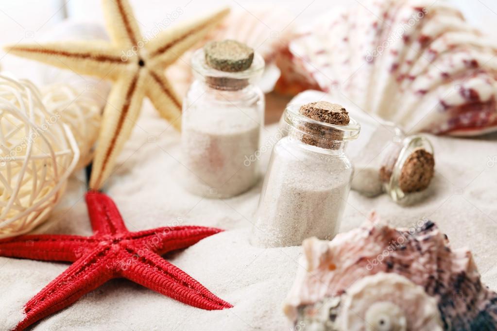 Beautiful seashells on sand background