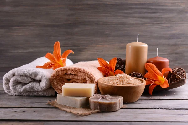 Beautiful spa composition with flowers on wooden table close up — Stock Photo, Image