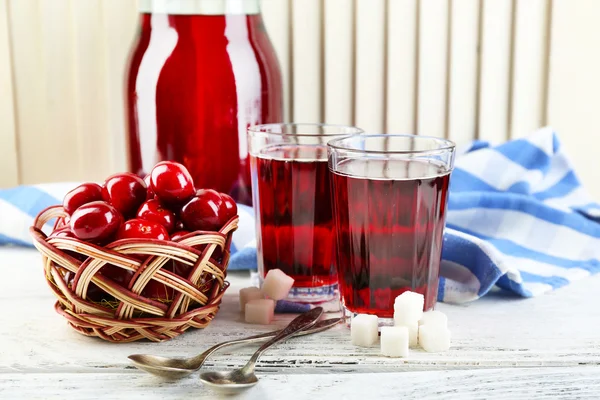 Sweet homemade cherry compote on table, on light background — Stock Photo, Image