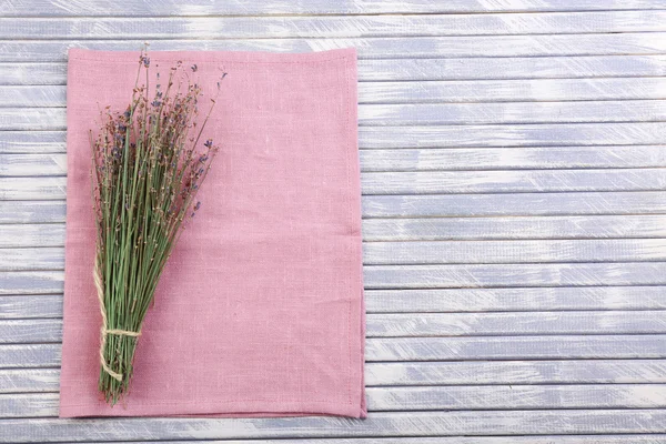 Beautiful dry flowers on napkin — Stock Photo, Image