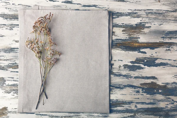 Beautiful dry flowers on napkin — Stock Photo, Image