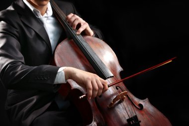 Man playing on cello clipart