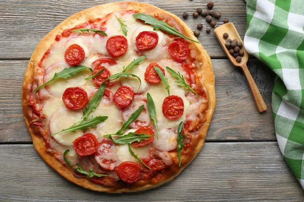 Delicious pizza with cheese and cherry tomatoes on wooden table, top view — Stock Photo, Image