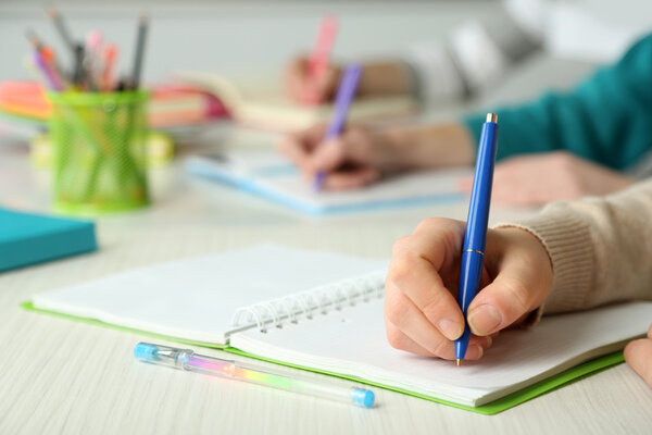 Hands of students at school