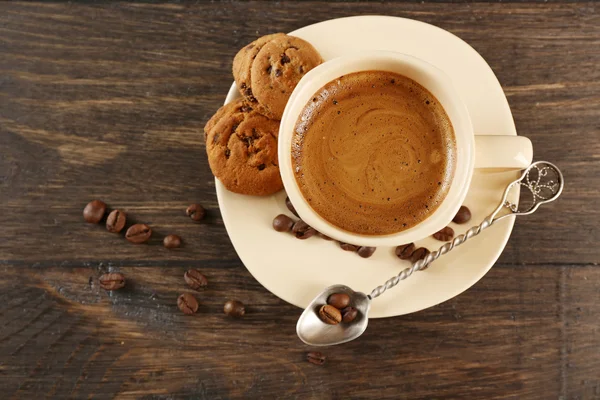 Cup of coffee on wooden table — Stock Photo, Image