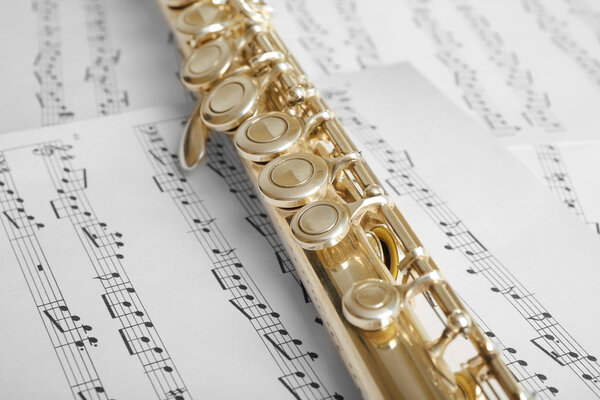 Flute on music notes background