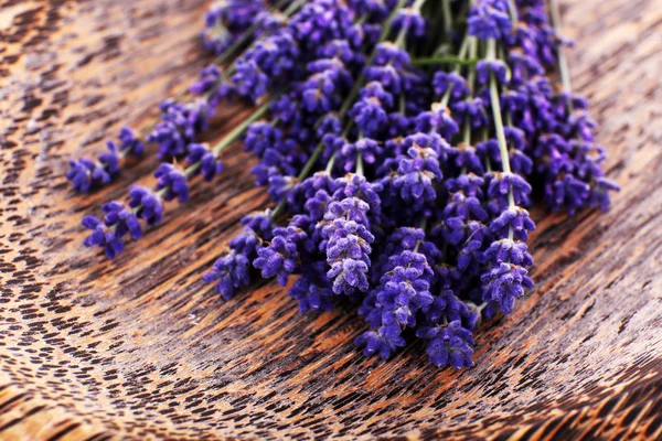 Fresh lavender on wooden table, closeup