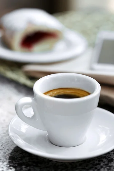 Cup of cappuccino on table in cafe — Stock Photo, Image