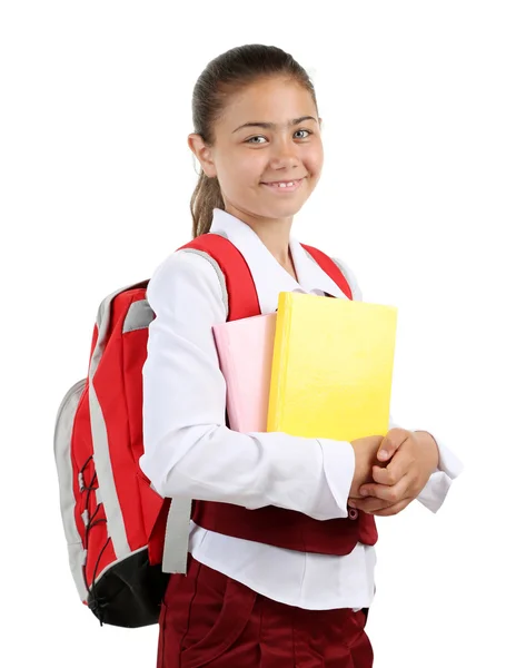 Güzel küçük bir kız okul üniforması üzerinde beyaz izole — Stok fotoğraf