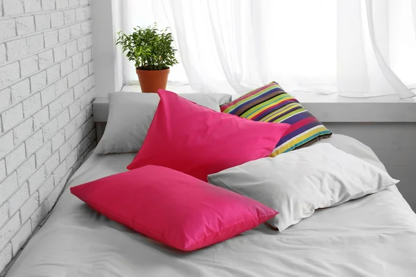 Comfortable bed with pillows — Stock Photo, Image