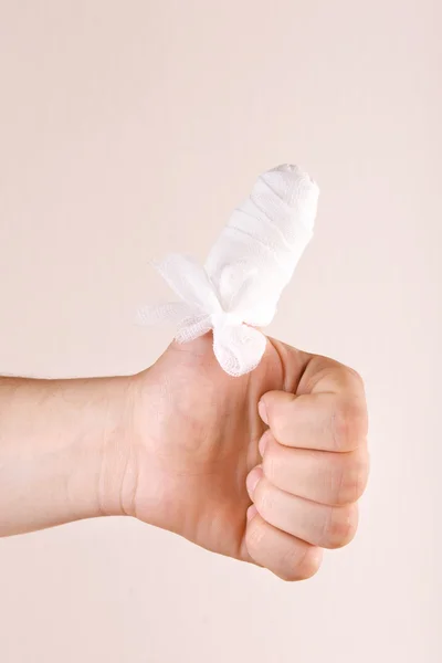 Injured bandaged finger — Stock Photo, Image