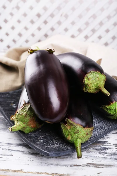 Fresh eggplant on wooden table, closeup — Stock Photo, Image