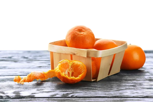 Ripe tangerines on wooden table isolated on white — Stock Photo, Image