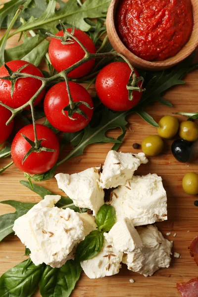 Ingredients of Mediterranean cuisine, on wooden board, top view — Stock Photo, Image